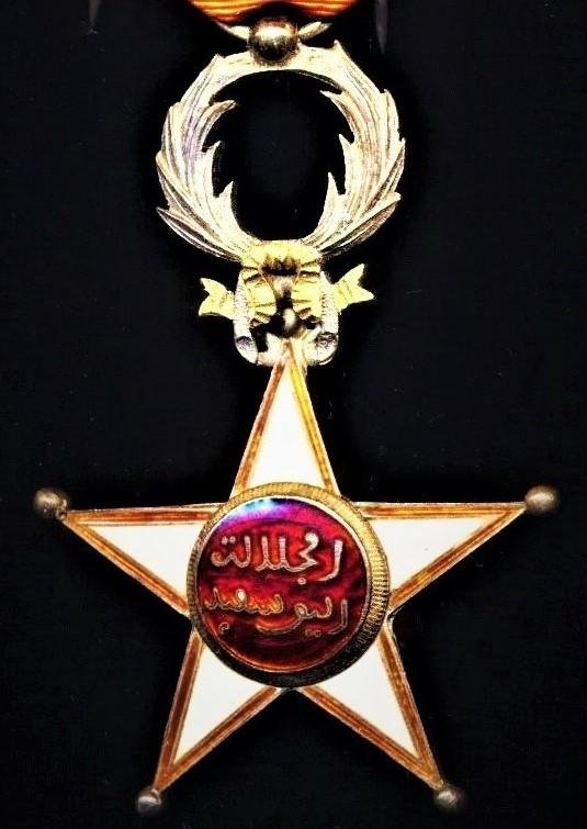 Morocco (Kingdom): Order of Ouissam Alaouite (Sharifian Order of Al-Alaoui). Fifth class 'Knight' breast badge on second type riband '1934-'. Silver gilt & enamel — image 2