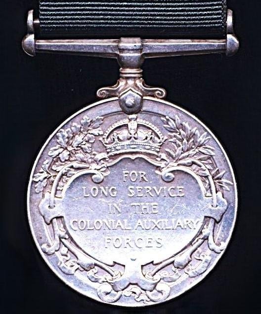 Colonial Auxiliary Forces Long Service medal. GV first issue, with swivel suspender (No. C.Q.M.Sjt. James Jayawardena, Ceylon L.I.) — image 2