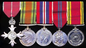 A Ceylon services M.B.E. group of 5 to the father …