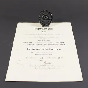 Black wound badge with award document