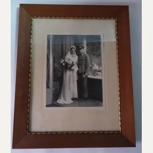 a picture of a couple in them wooden original fram