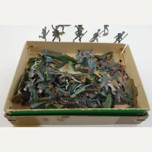 about 50 tinnie toy soldiers in original box