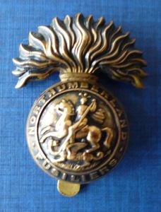 WW1 Northumberland Fusiliers Economy all-brass Cap-badge.