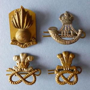 Group of Four Single Metal Army Collar Badges.