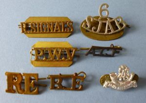 Group of Seven Single Metal Shoulder-titles.