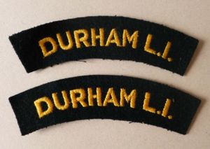Pair of Durham Light Infantry 'Durham L.I.' machine-embroidered cloth shoulder …