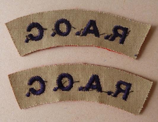 Pair of Royal Army Ordnance Corps 'R.A.O.C.' machine-embroidered cloth shoulder titles. — image 2