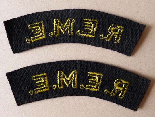Pair of Royal Electrical & Mechanical Engineers 'R.E.M.E.' machine-embroidered cloth shoulder titles. — image 2