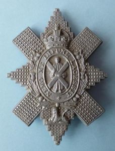 WW2 The Black Watch Plastic War-economy Cap-badge.
