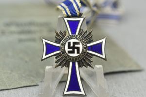 Silver mother's cross with award envelope by E.F. Wiedmann