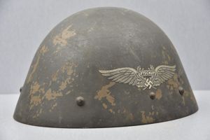 M34 Czech reissued Luftschutz helmet with odd placed decal