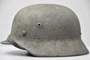 M35 Army (Heer) re-issued steel helmet with thick sawdust camouflage …