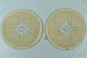 Army (Heer) 'Oberschütze' rank sleeve badge in white HBT