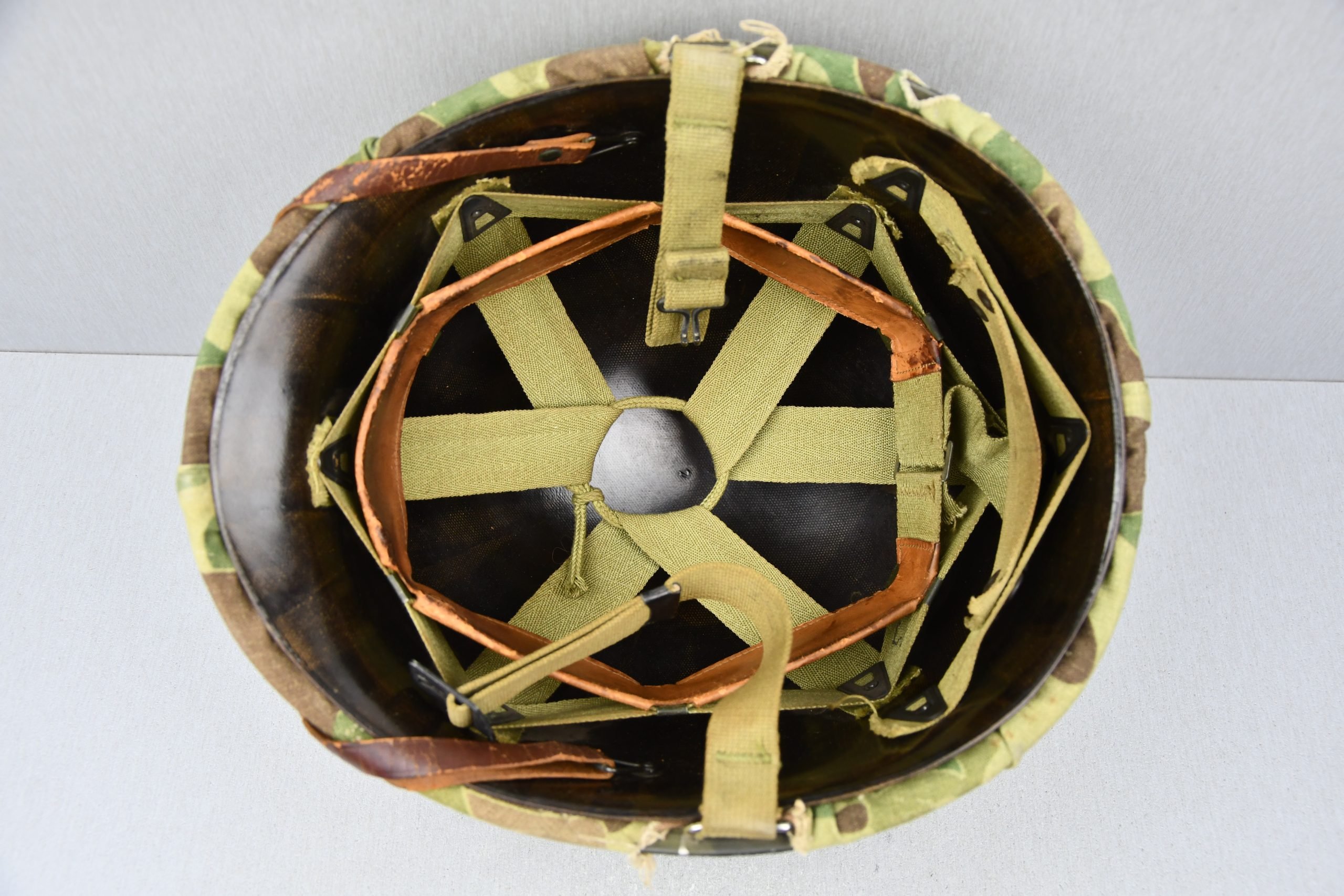 US WW2 M1 steel fixed bail helmet with liner by 'Int'l Molded Plastics Co' and USMC camo cover — image 10