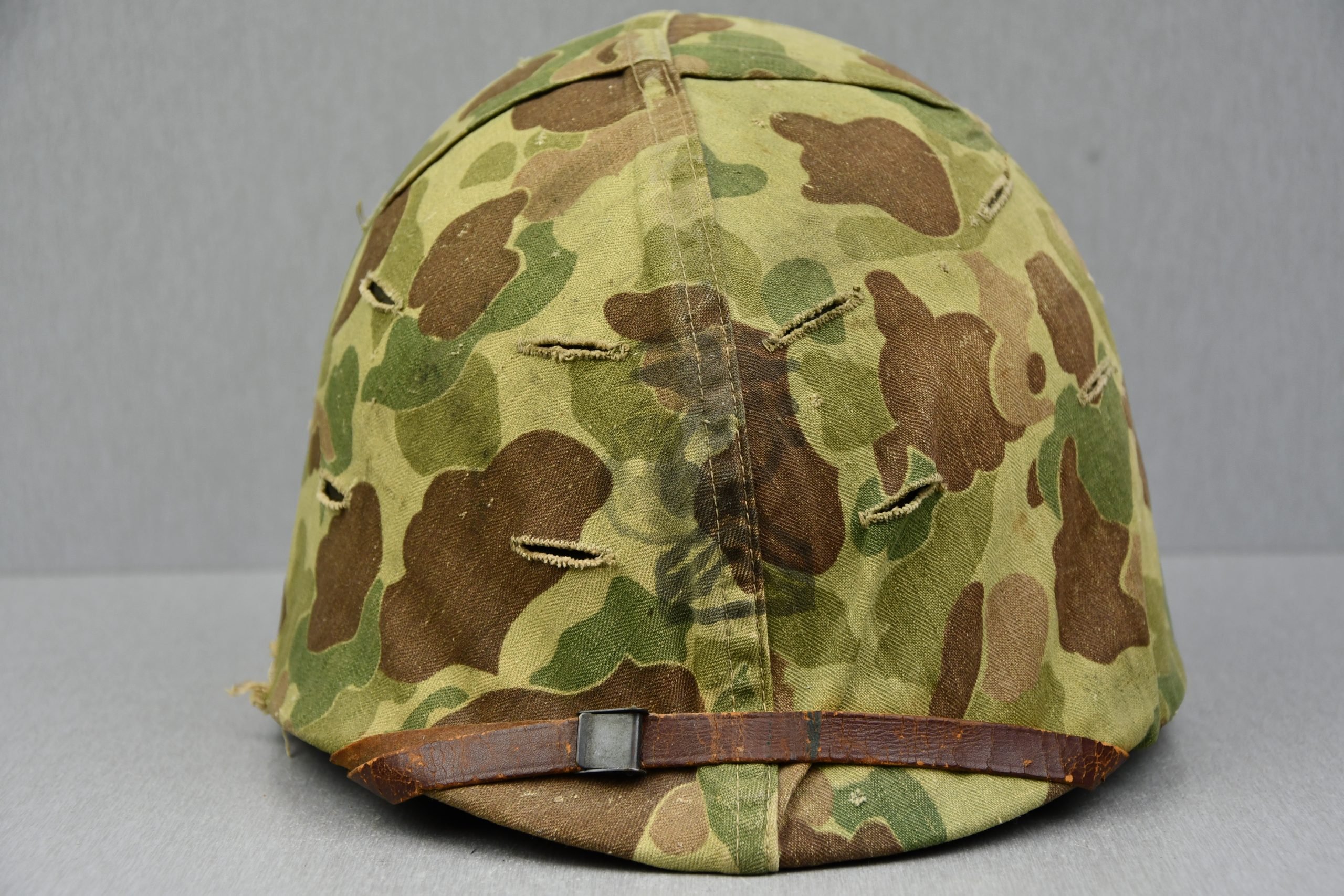 US WW2 M1 steel fixed bail helmet with liner by 'Int'l Molded Plastics Co' and USMC camo cover — image 2