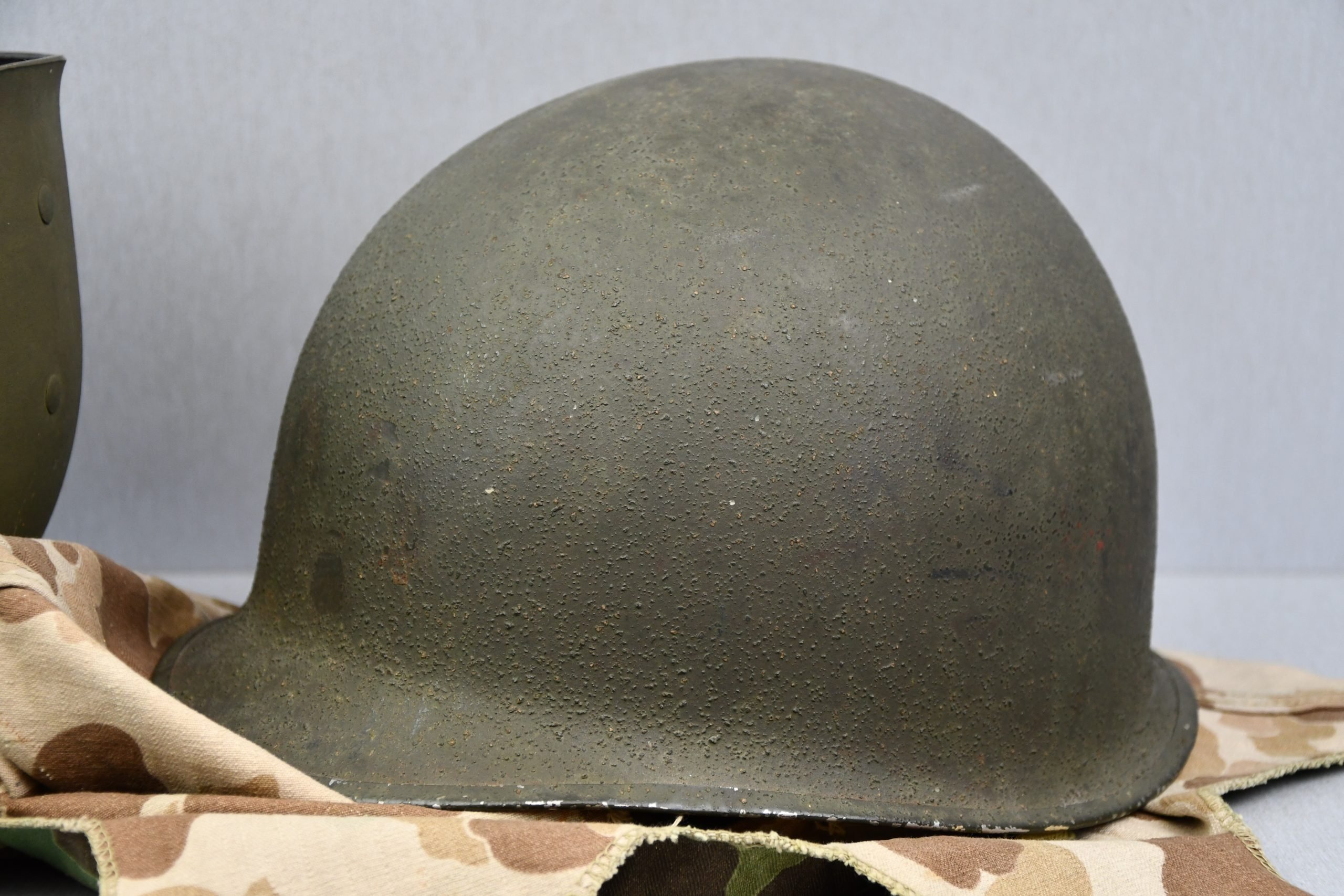 US WW2 M1 steel fixed bail helmet with liner by 'Int'l Molded Plastics Co' and USMC camo cover — image 23