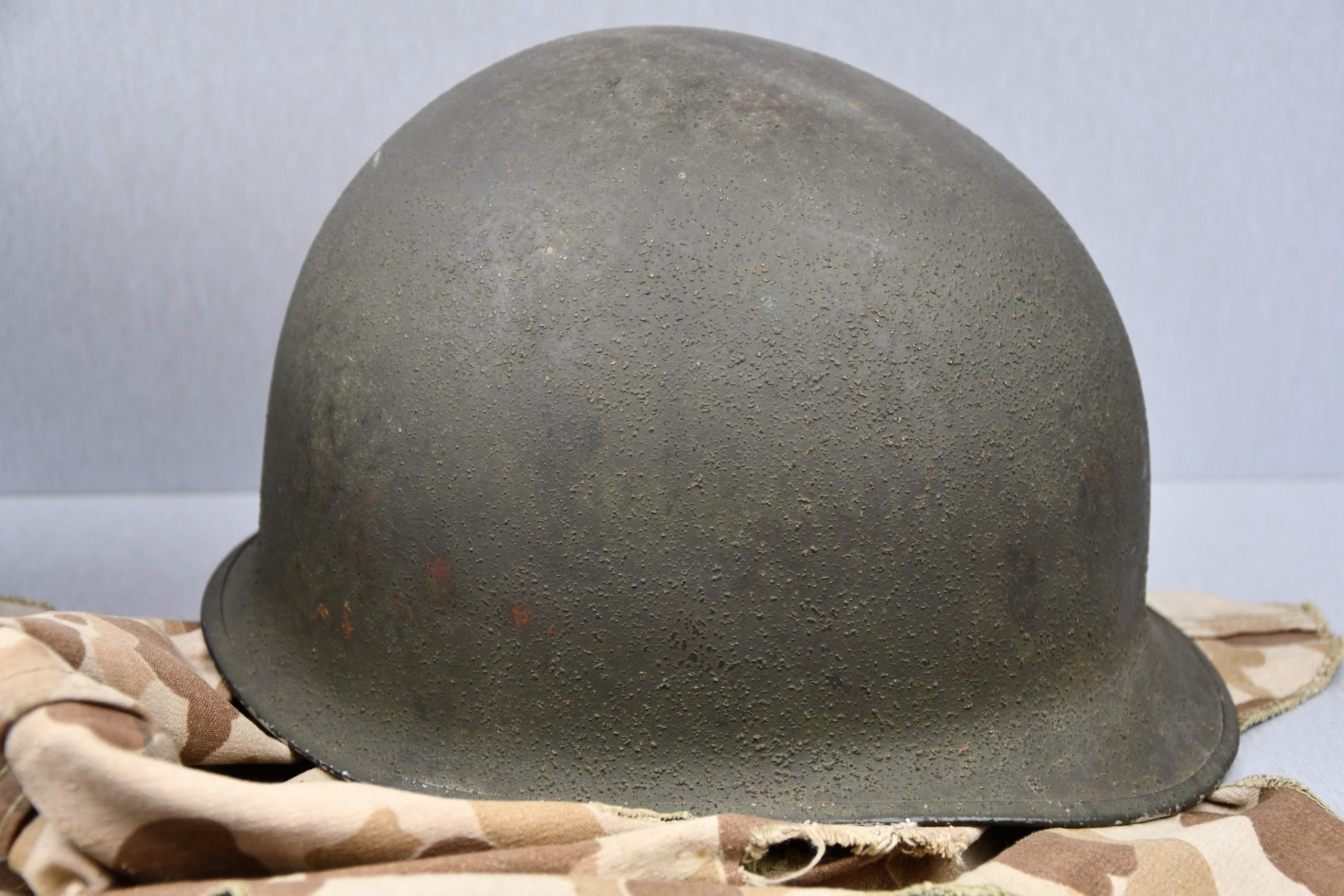 US WW2 M1 steel fixed bail helmet with liner by 'Int'l Molded Plastics Co' and USMC camo cover — image 24