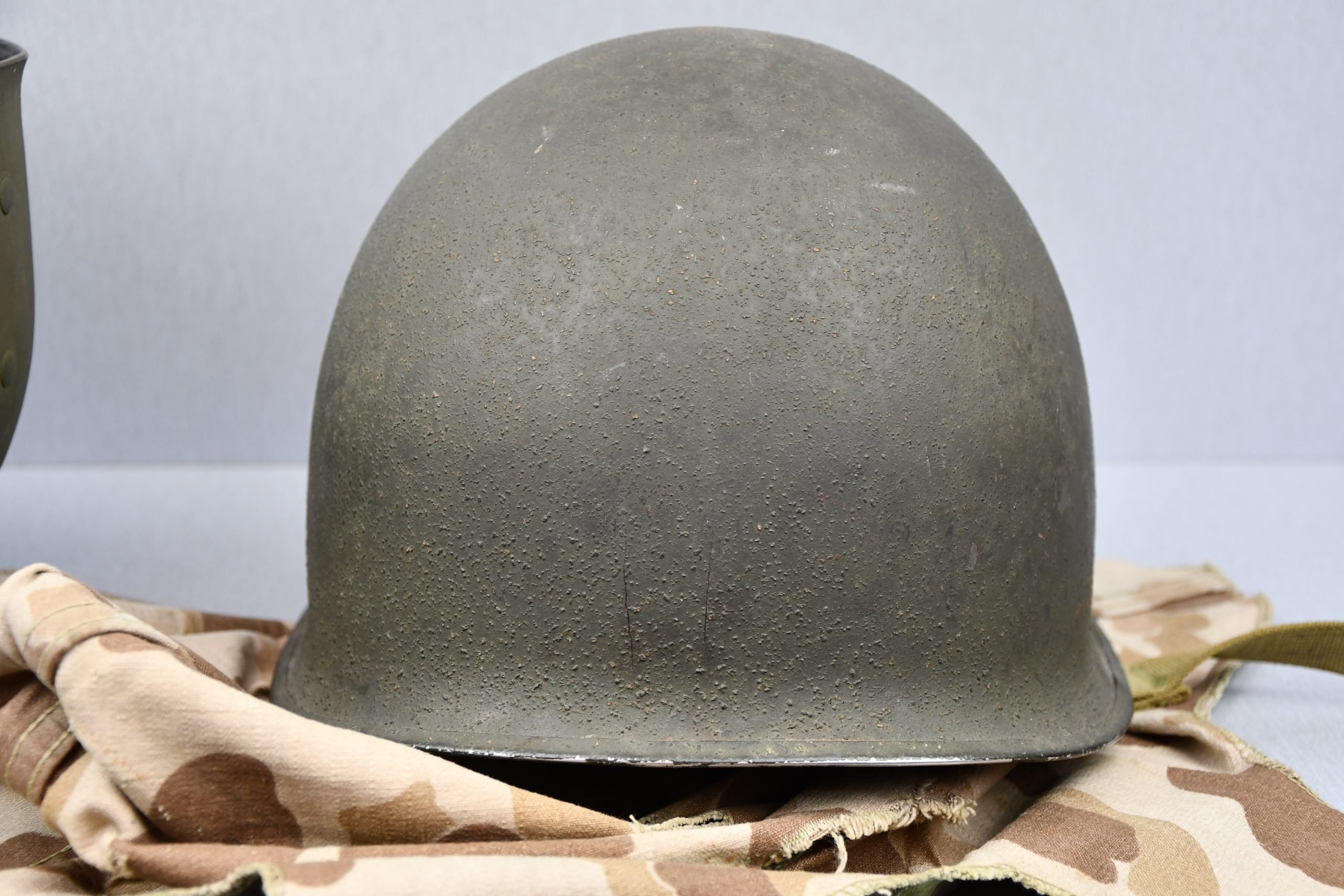 US WW2 M1 steel fixed bail helmet with liner by 'Int'l Molded Plastics Co' and USMC camo cover — image 25
