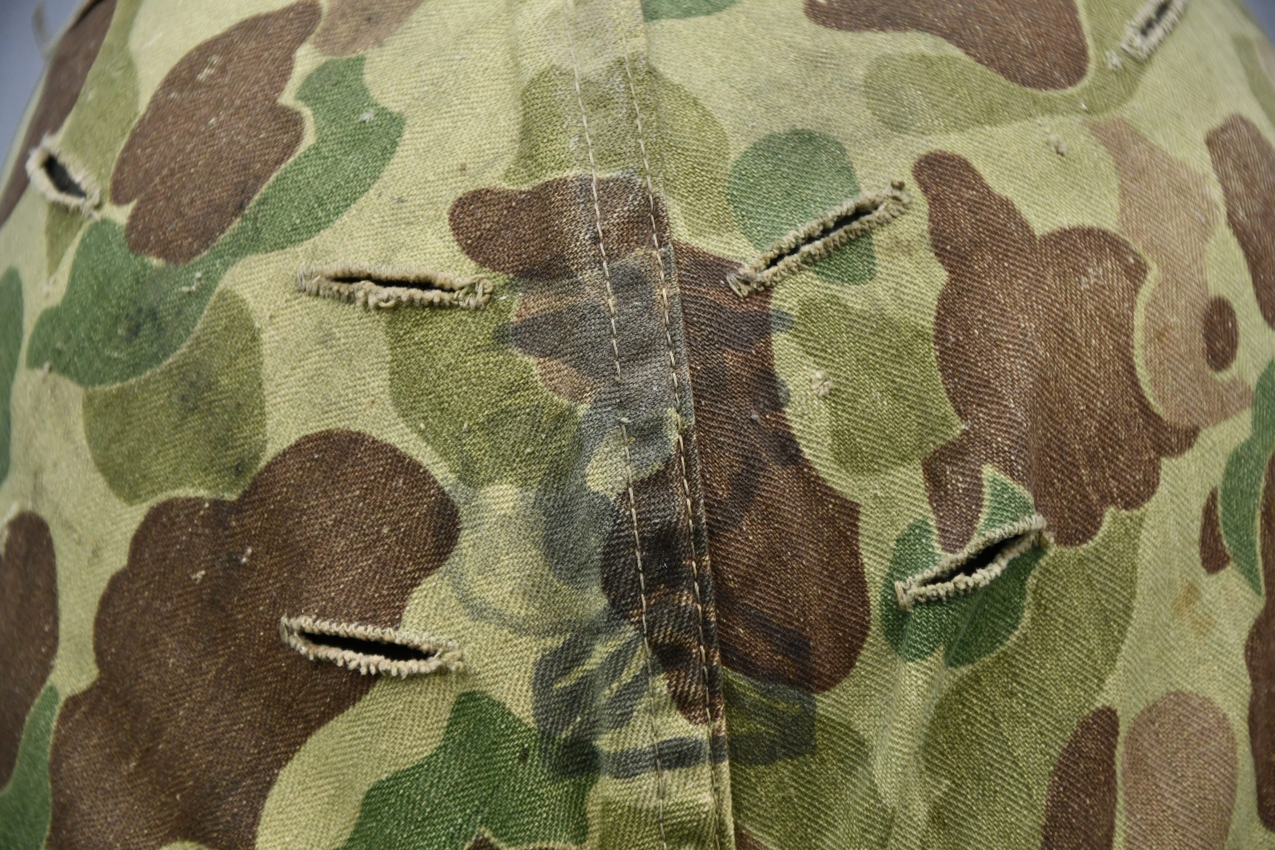 US WW2 M1 steel fixed bail helmet with liner by 'Int'l Molded Plastics Co' and USMC camo cover — image 3