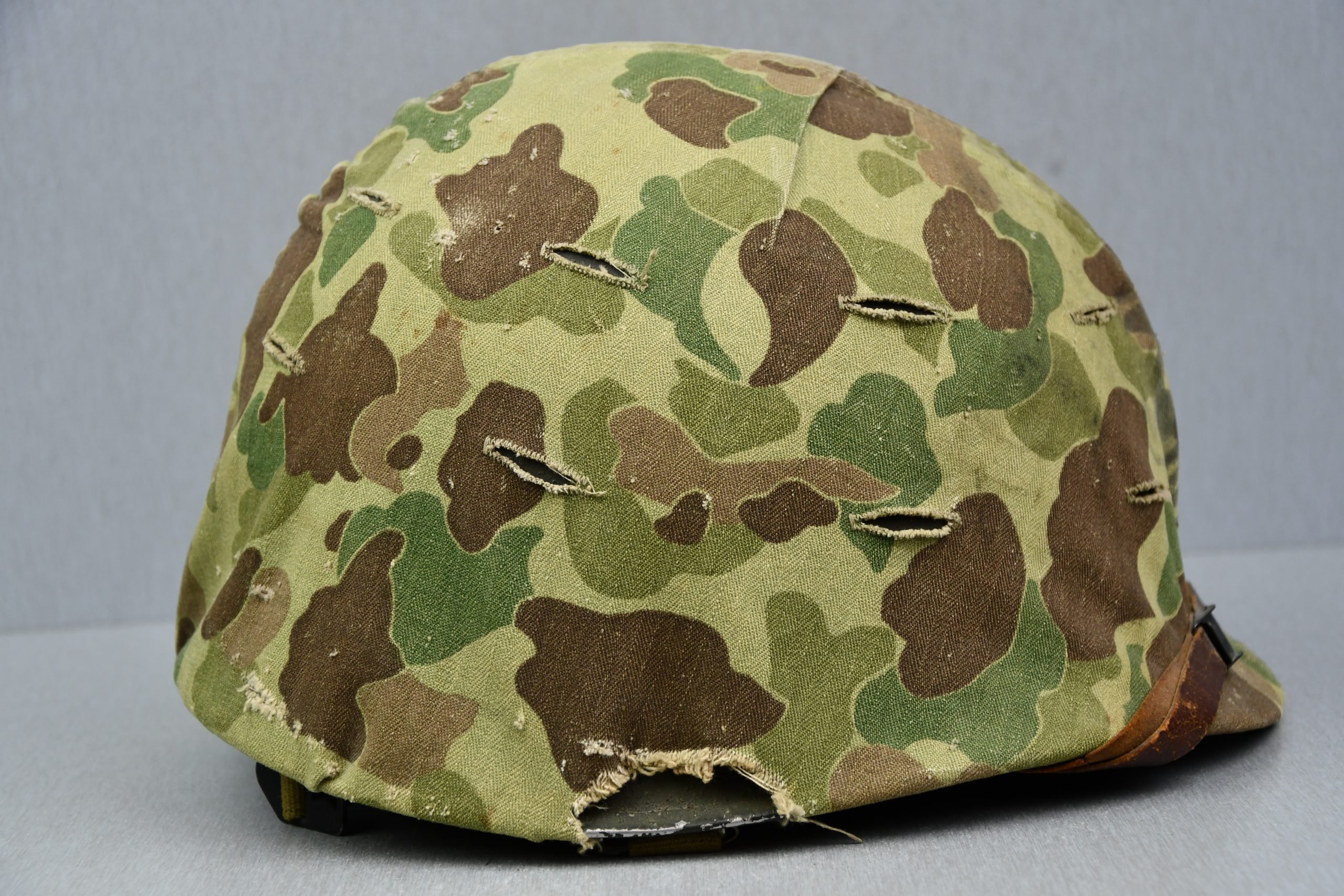 US WW2 M1 steel fixed bail helmet with liner by 'Int'l Molded Plastics Co' and USMC camo cover — image 6