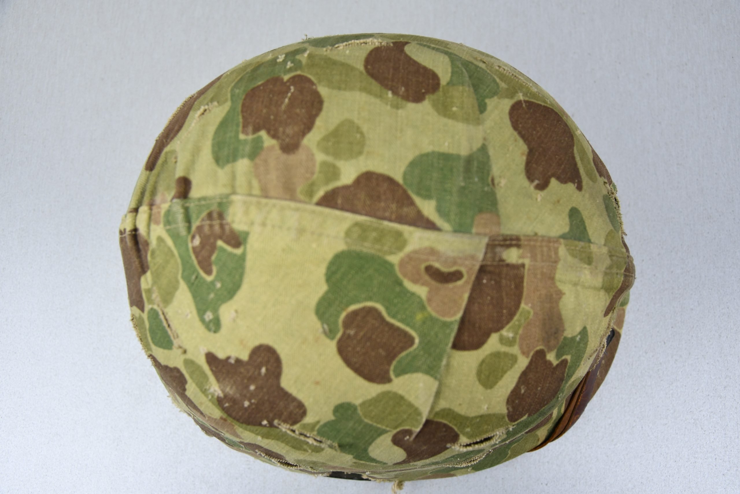 US WW2 M1 steel fixed bail helmet with liner by 'Int'l Molded Plastics Co' and USMC camo cover — image 7