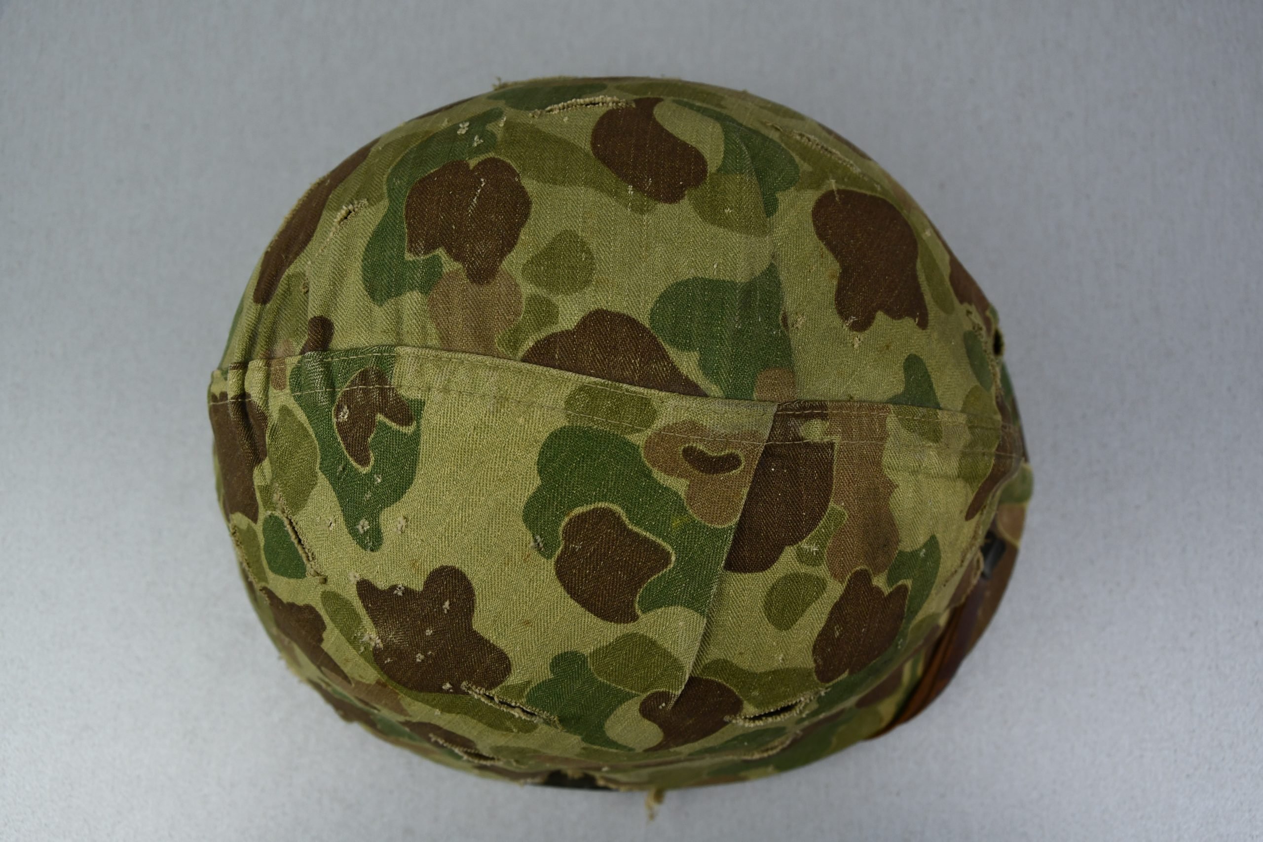 US WW2 M1 steel fixed bail helmet with liner by 'Int'l Molded Plastics Co' and USMC camo cover — image 8