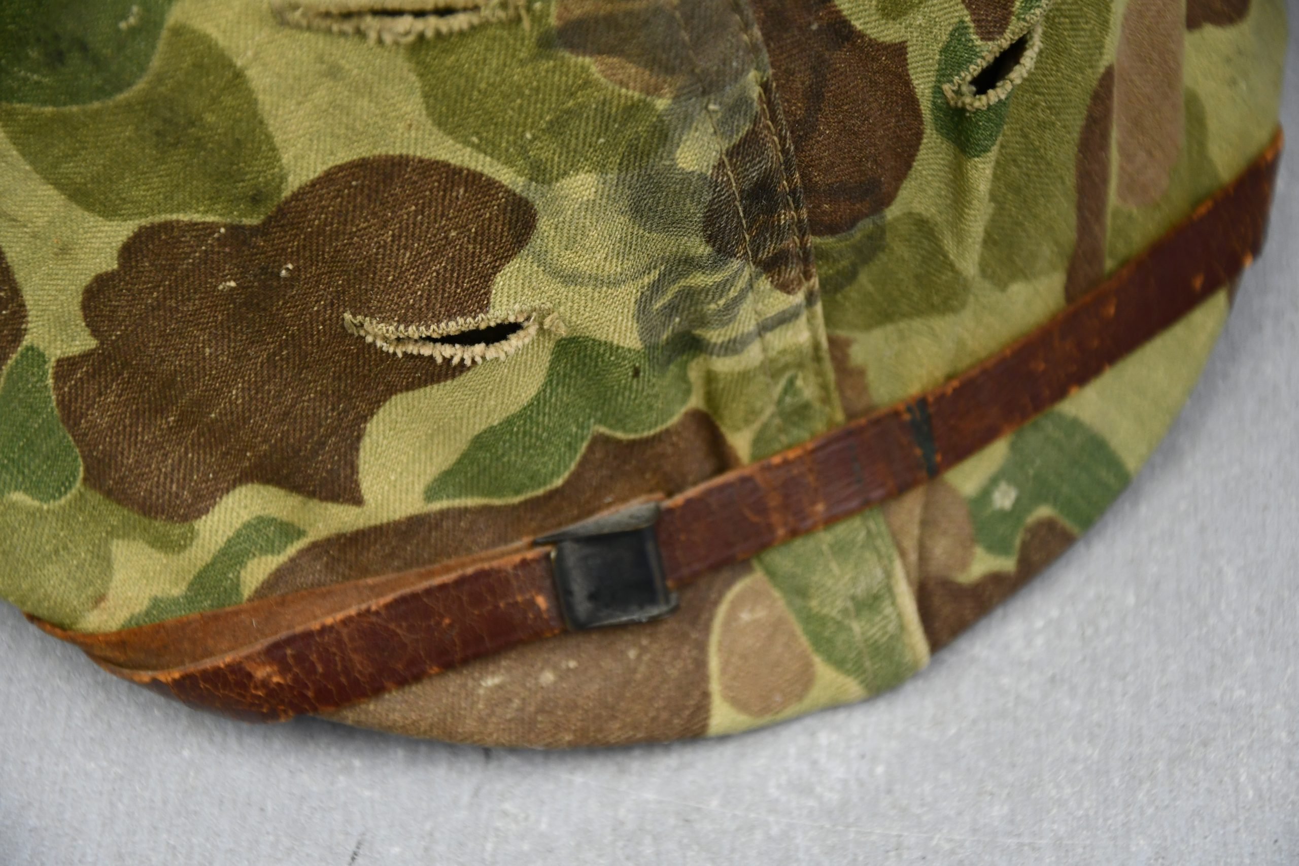 US WW2 M1 steel fixed bail helmet with liner by 'Int'l Molded Plastics Co' and USMC camo cover — image 9