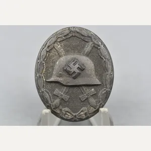Silver wound badge by Carl Wild '107'