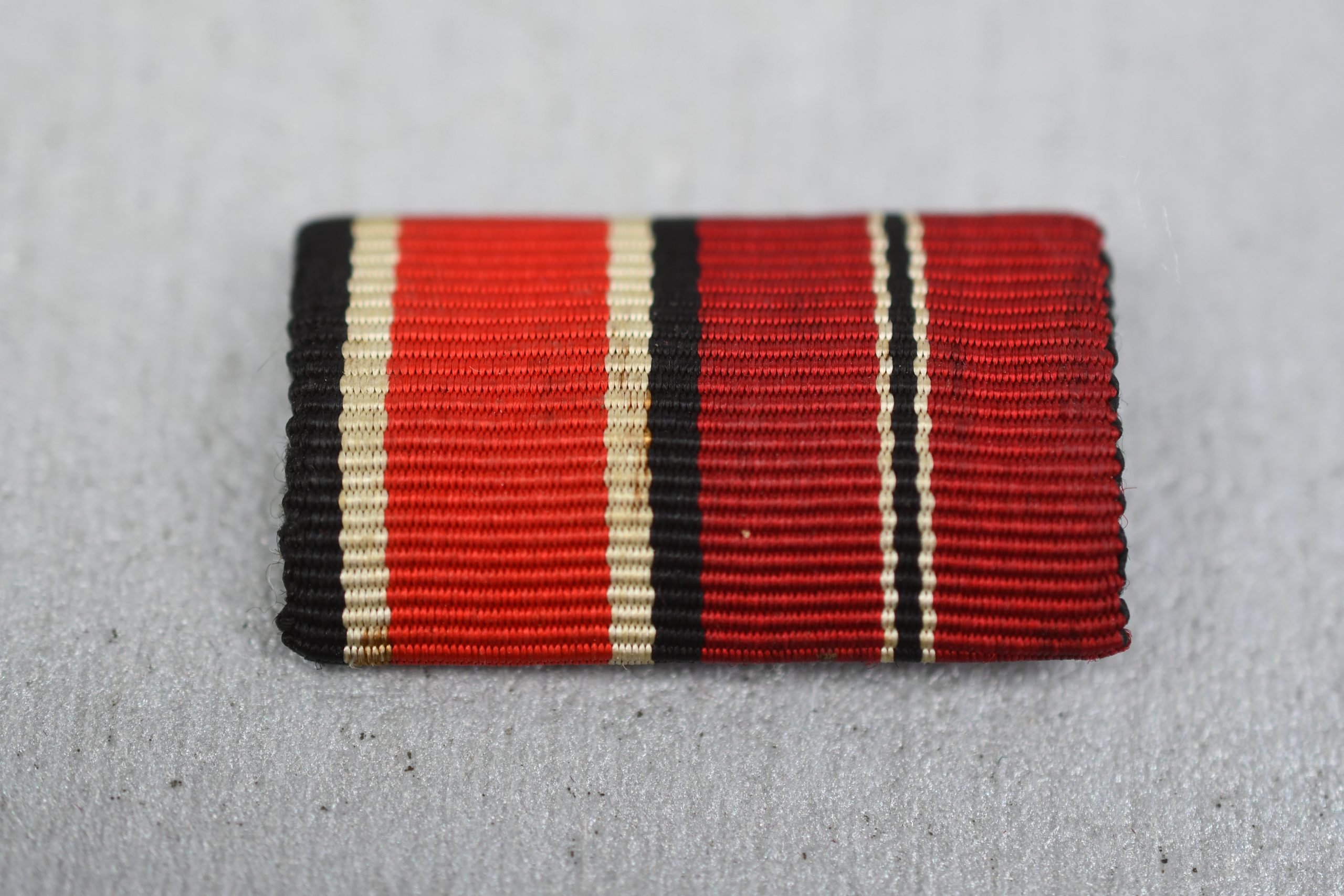 Two piece ribbon bar Iron Cross second class and Eastern Front Medal