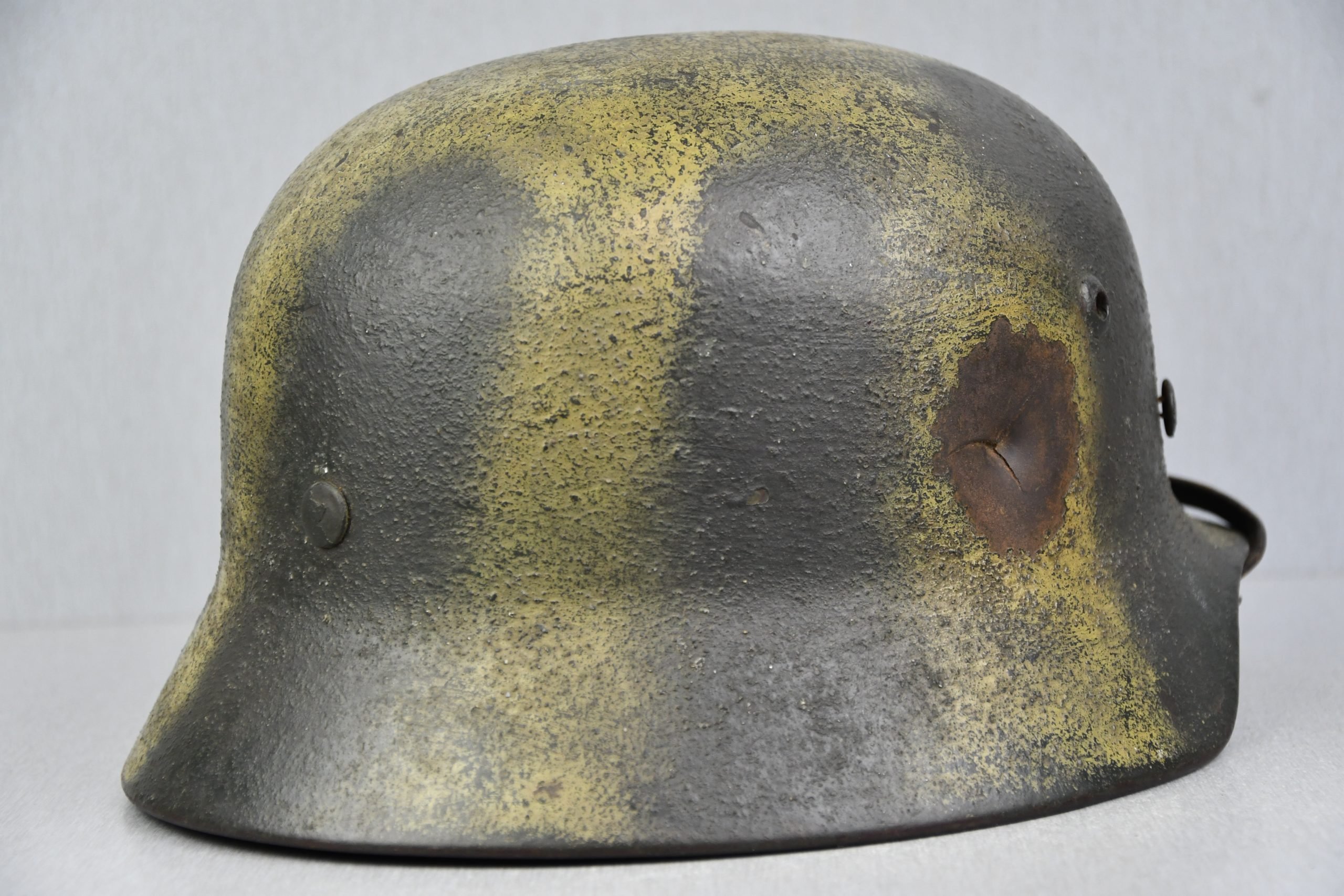 M35 army (Heer) reissued single decal camouflage steel helmet with bullet hit — image 10