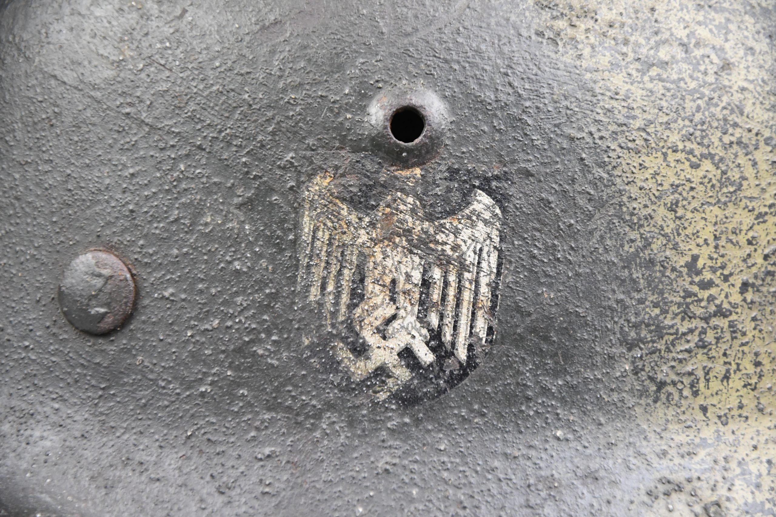 M35 army (Heer) reissued single decal camouflage steel helmet with bullet hit — image 2