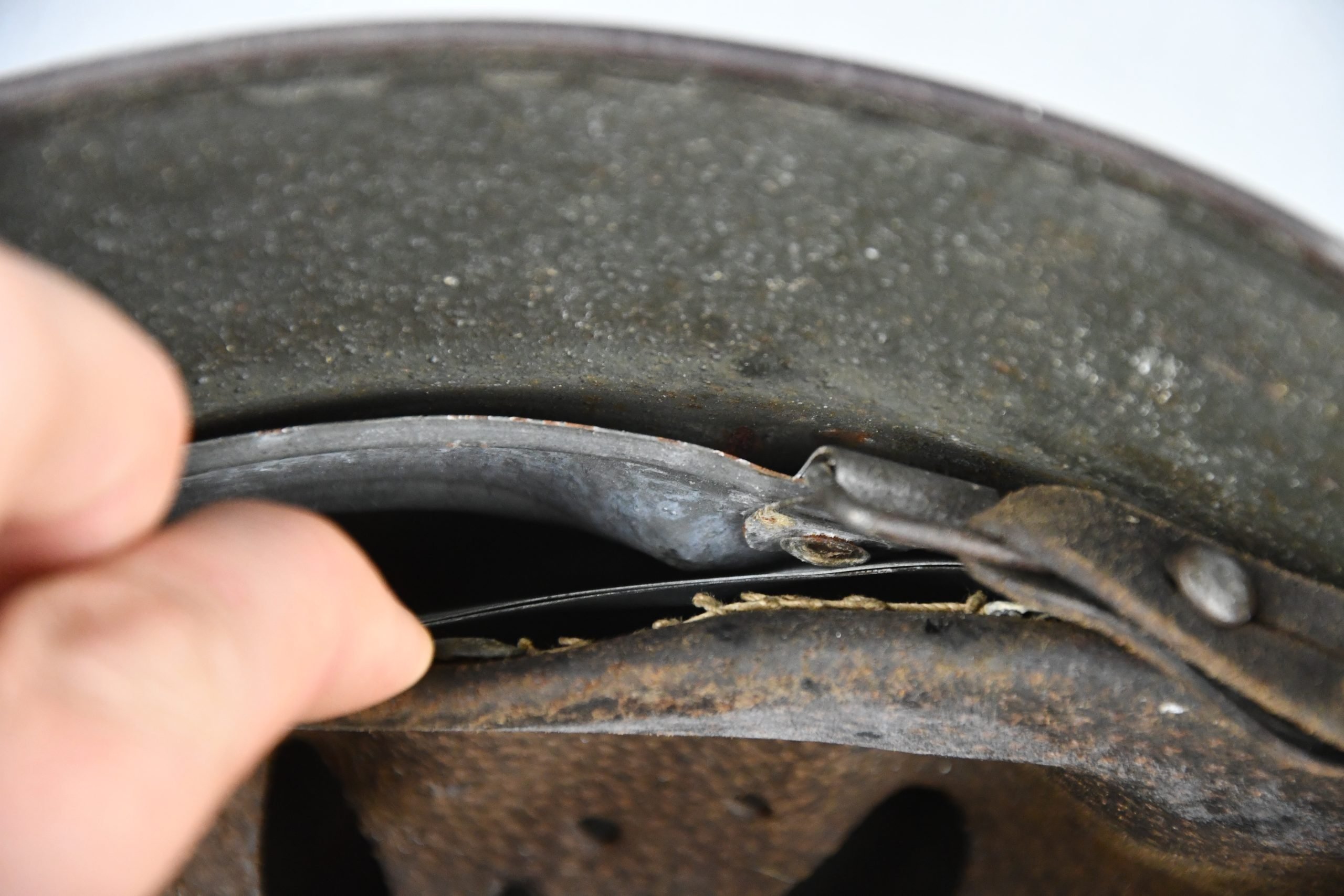 M35 army (Heer) reissued single decal camouflage steel helmet with bullet hit — image 21