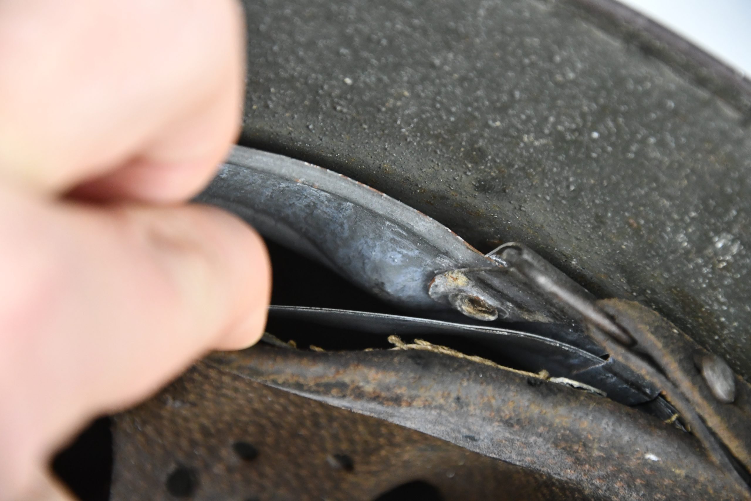 M35 army (Heer) reissued single decal camouflage steel helmet with bullet hit — image 22