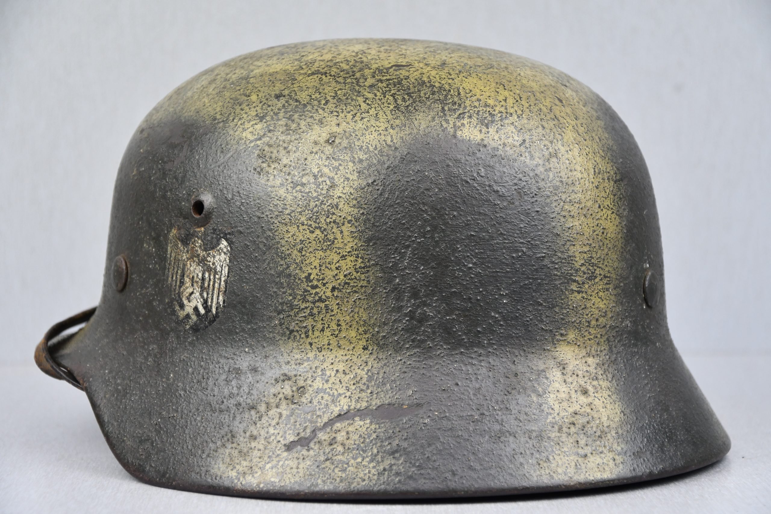 M35 army (Heer) reissued single decal camouflage steel helmet with bullet hit — image 7