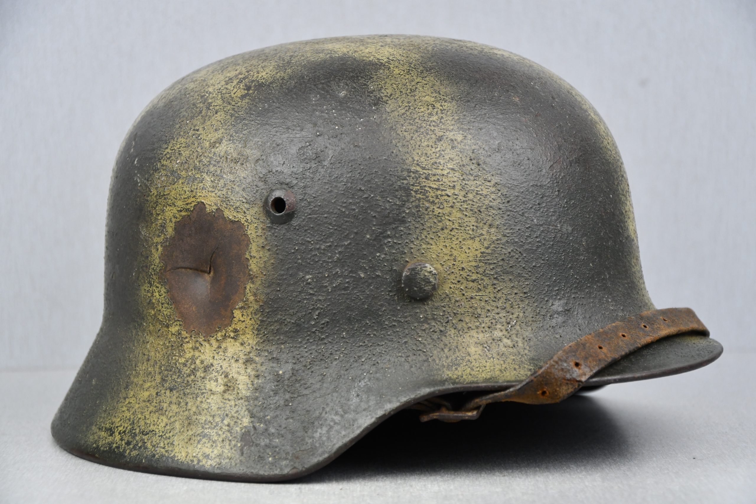 M35 army (Heer) reissued single decal camouflage steel helmet with bullet hit — image 9