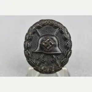 First pattern black wound badge