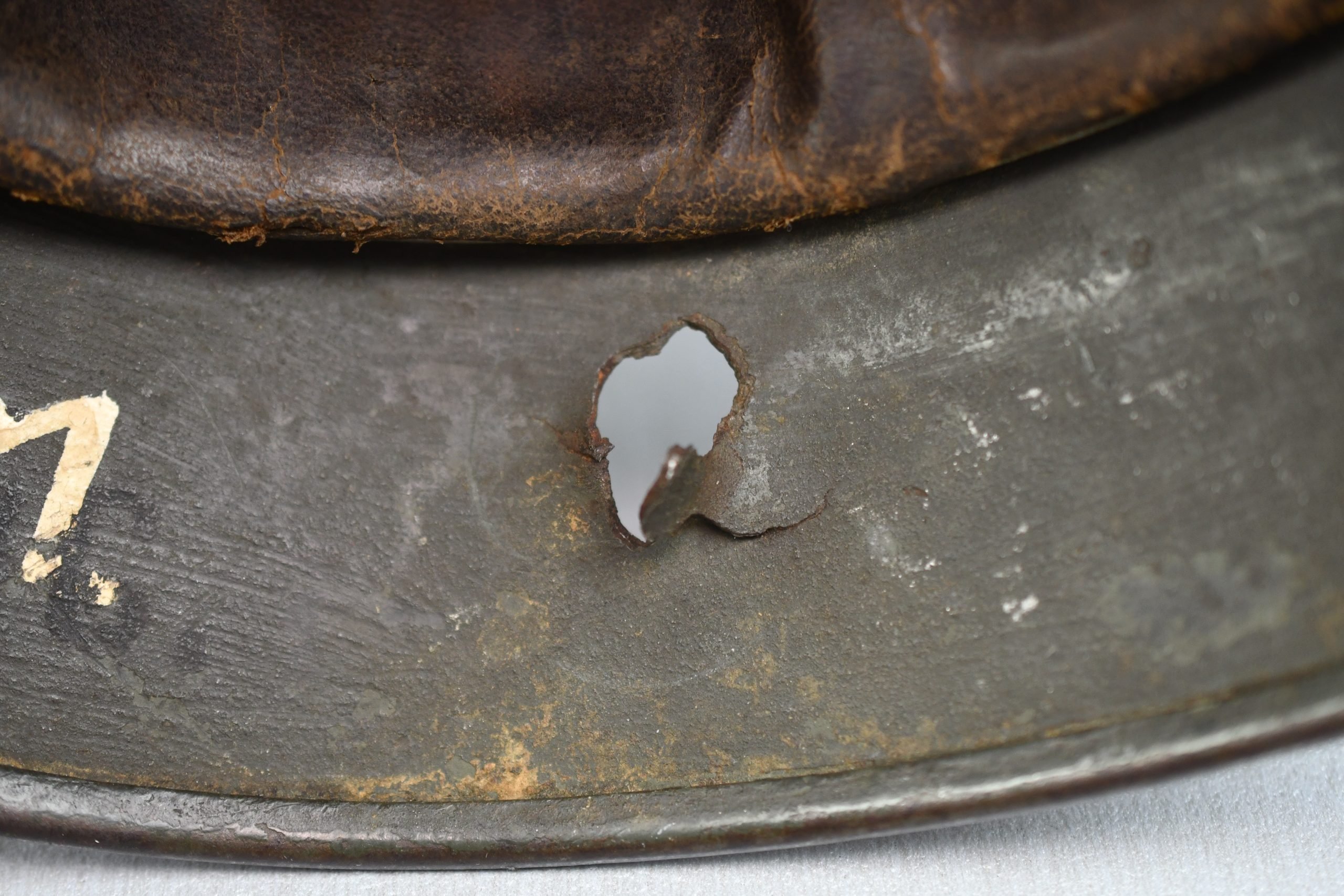 M35 Army (Heer) three tone 'Normandy' camouflage helmet EF62 bullet hit — image 14