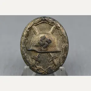 Silver wound badge by Carl Wild '107'