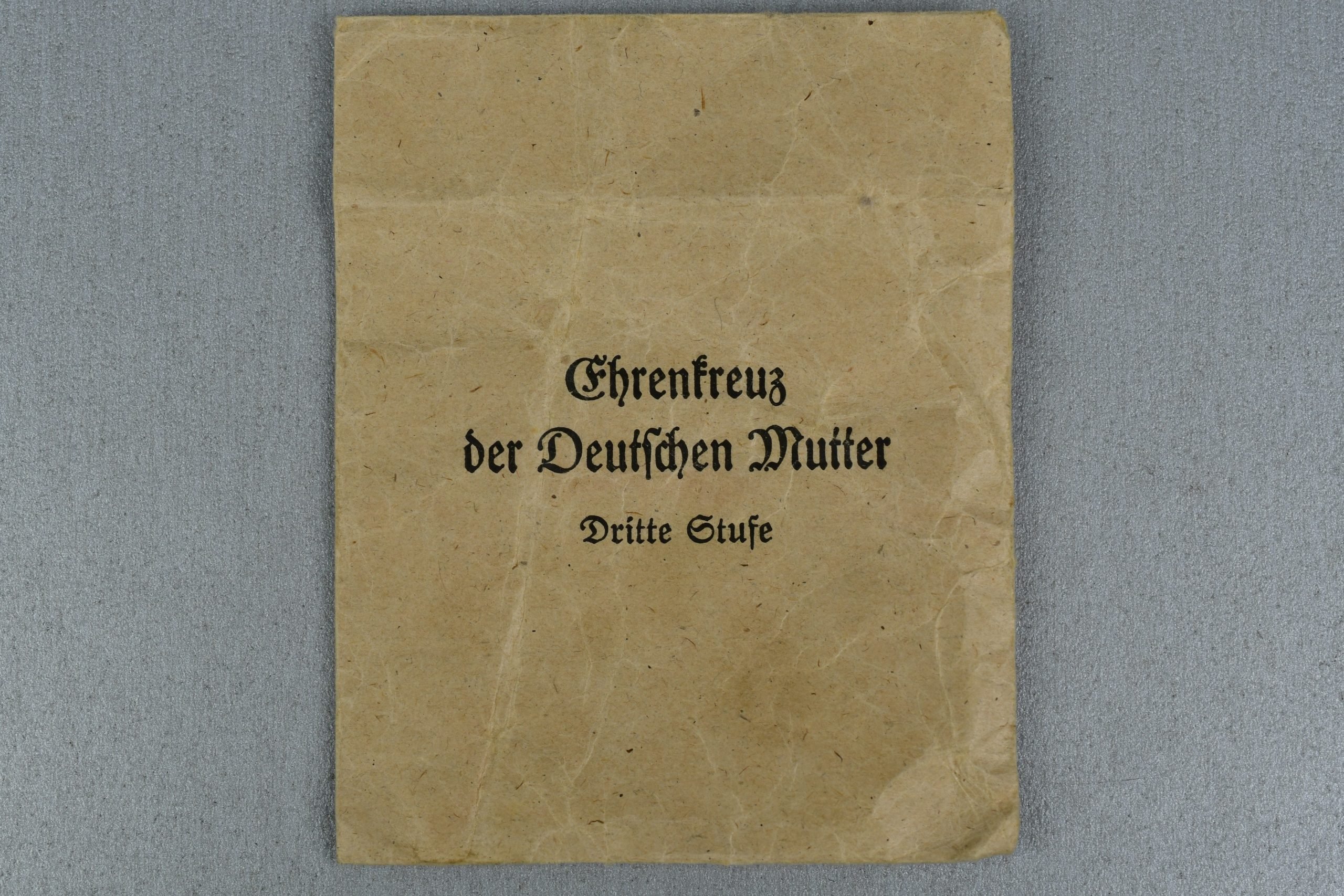 Bronze mother's cross with award envelope by Jakob Bengel — image 4