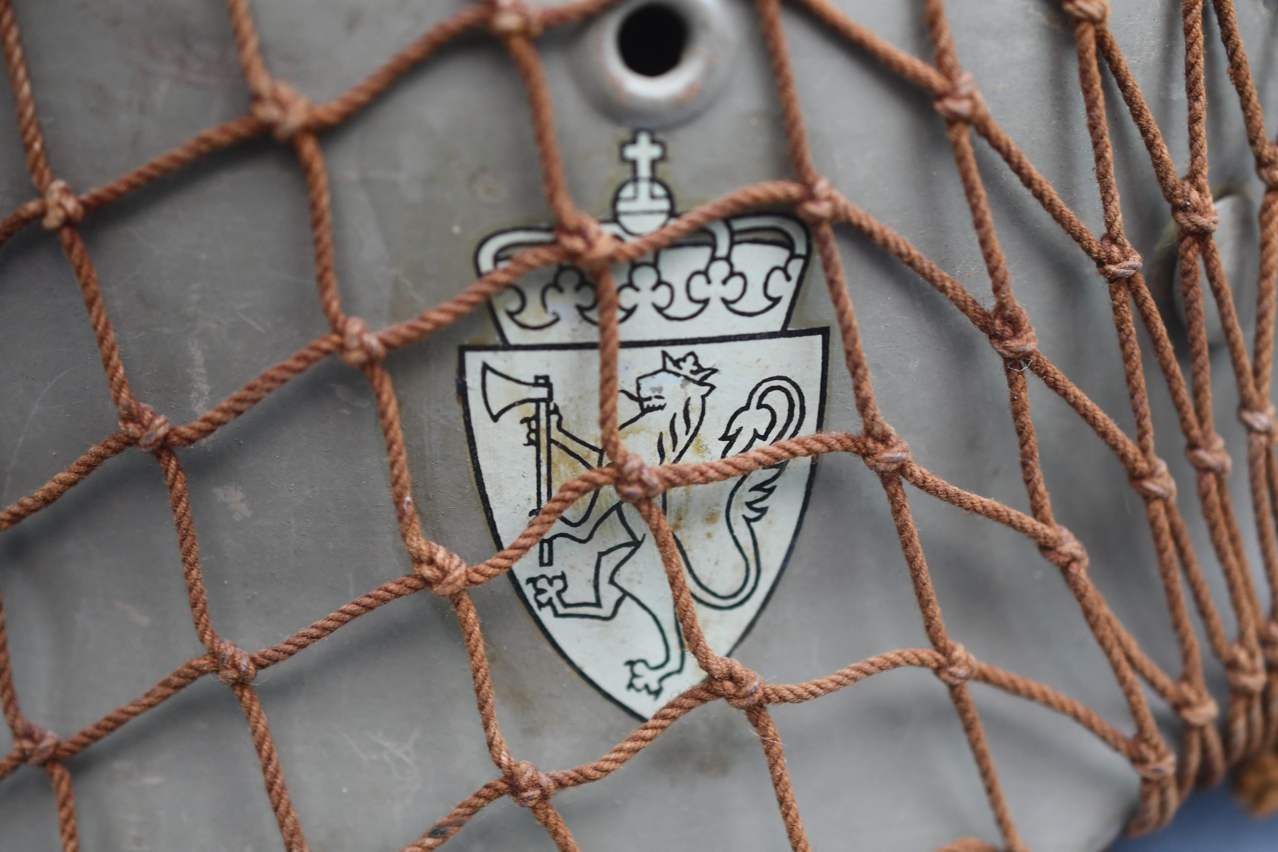 M40 Norwegian reissued steel helmet ET64 with camouflage net — image 10