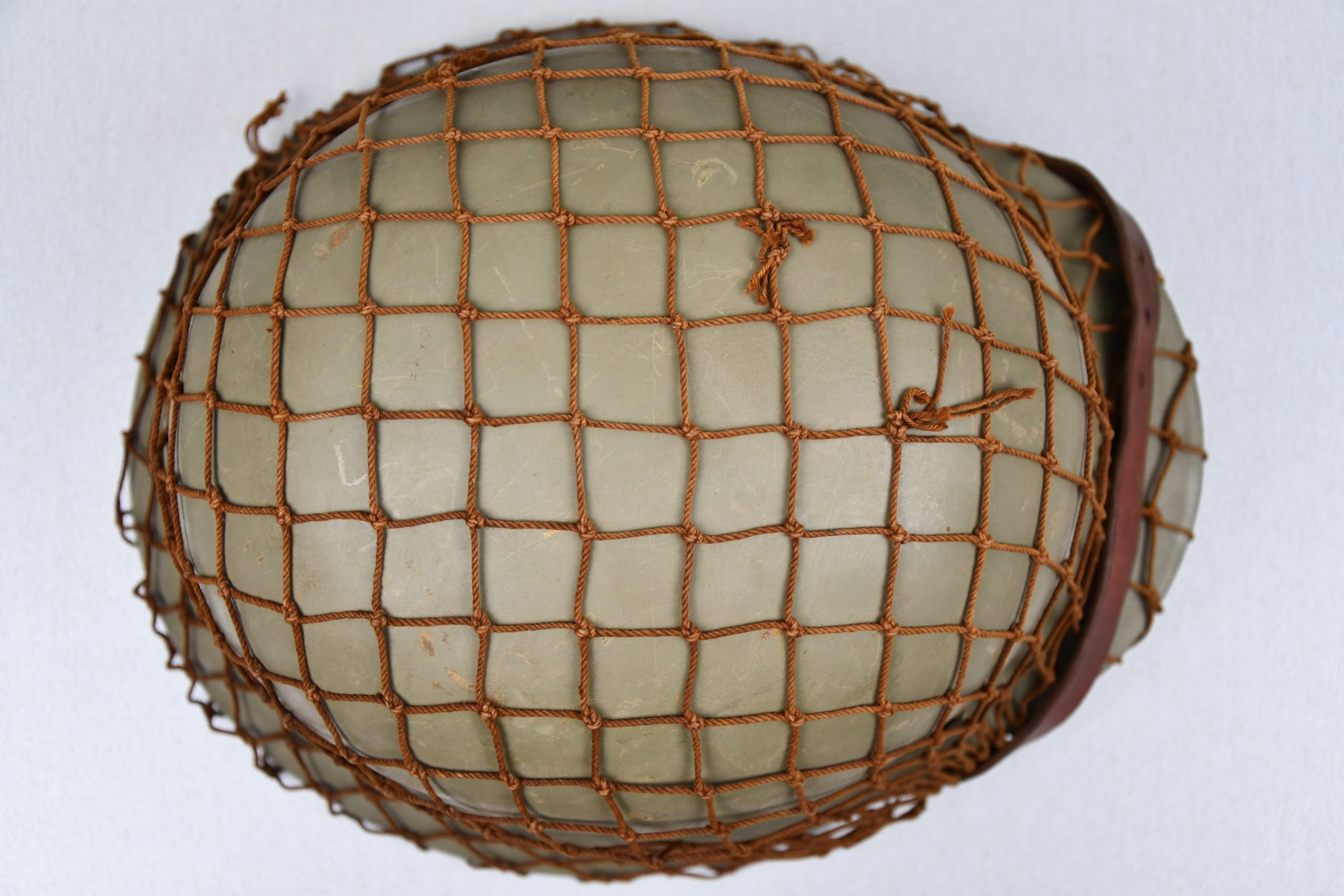 M40 Norwegian reissued steel helmet ET64 with camouflage net — image 7