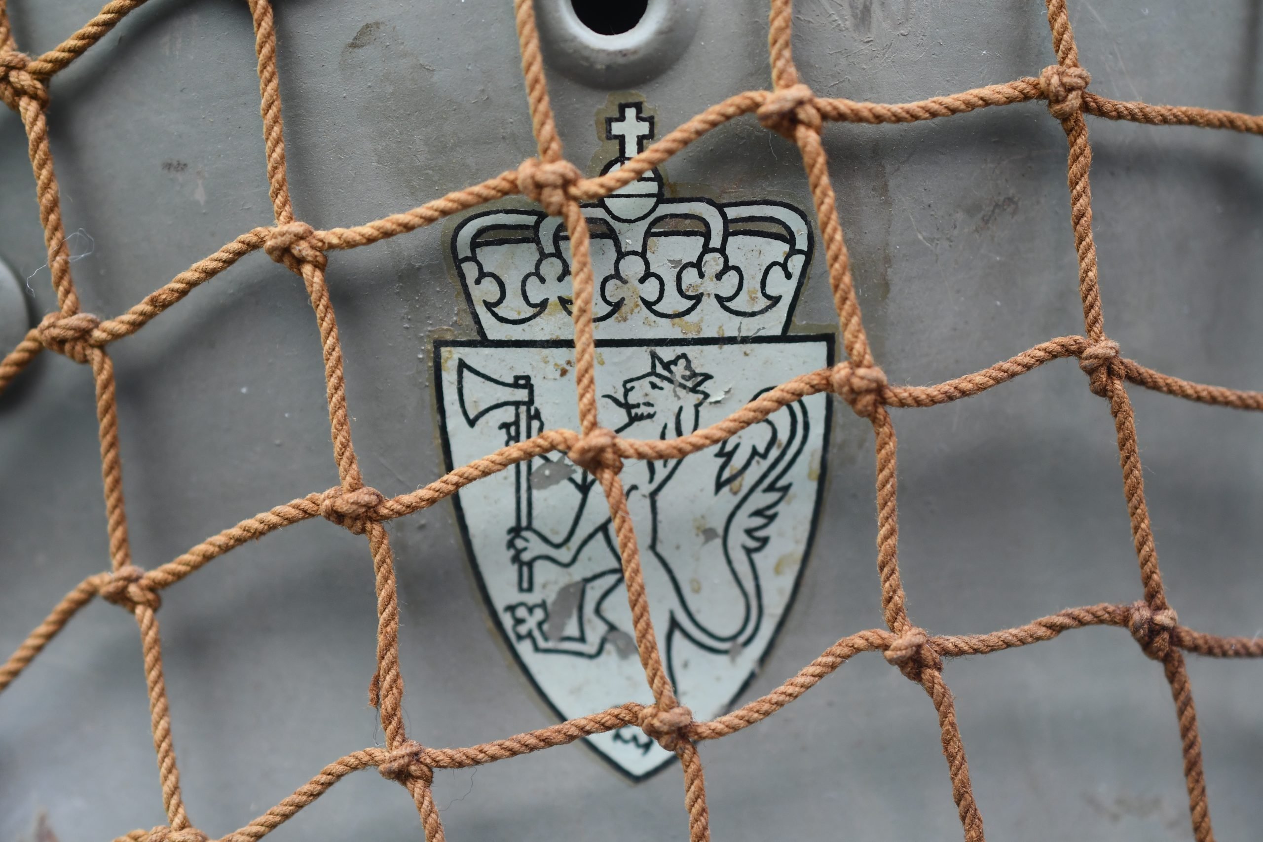 M40 Norwegian reissued steel helmet ET64 with camouflage net — image 9