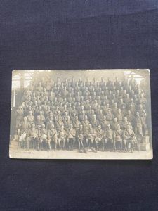 POSTCARD OF A BRITISH MILITARY COMPANY