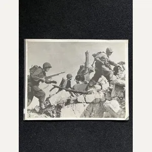 U.S. MARINES HURDLE STONE WALL IN OKINAWA ADVANCE