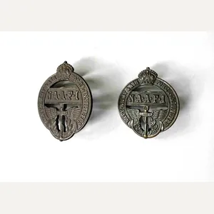A Pair of Collar Badges: NAAFI K.C.