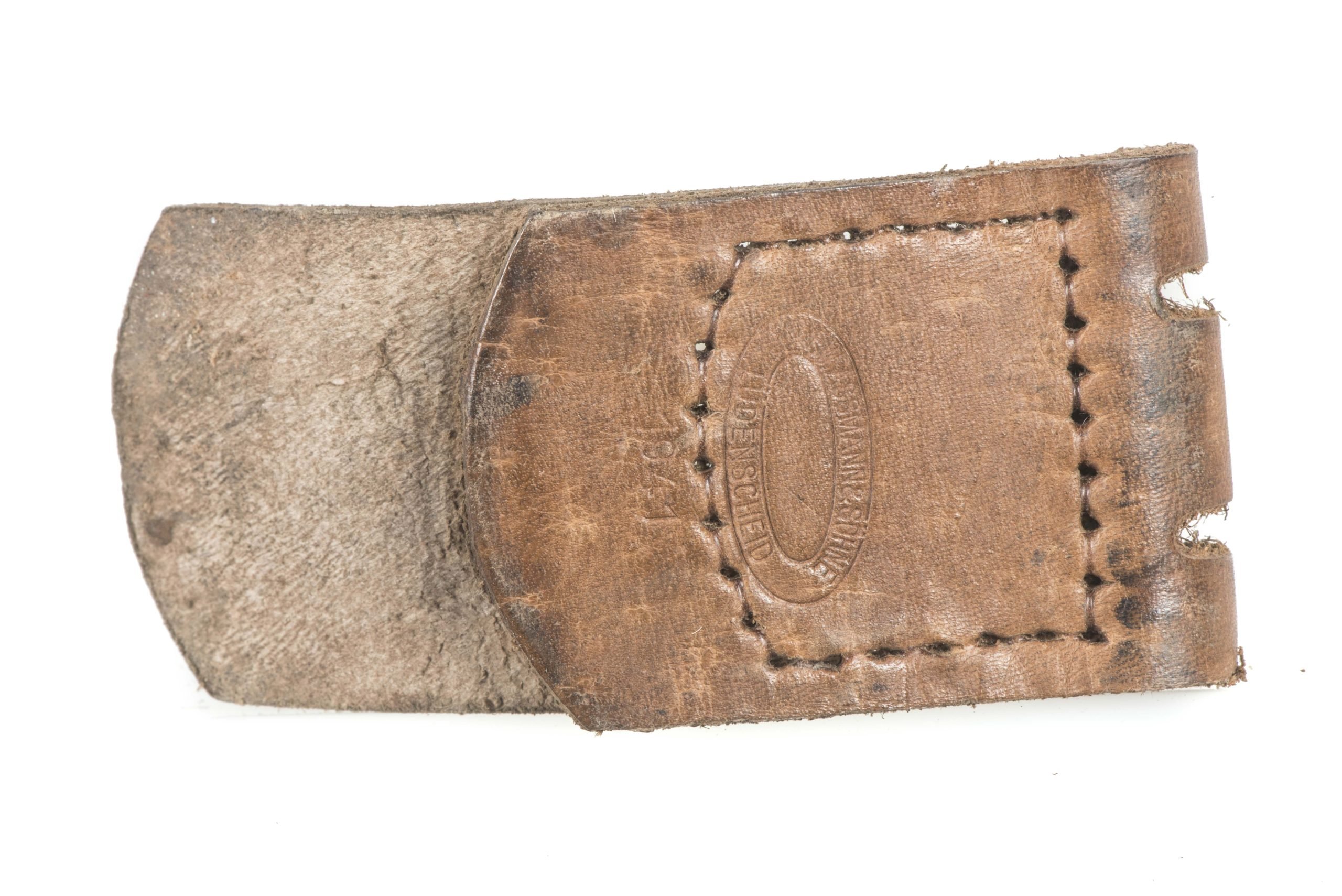 Leather belt buckle tab marked F.W. Assmann & Söhne, Lüdenscheid 1942