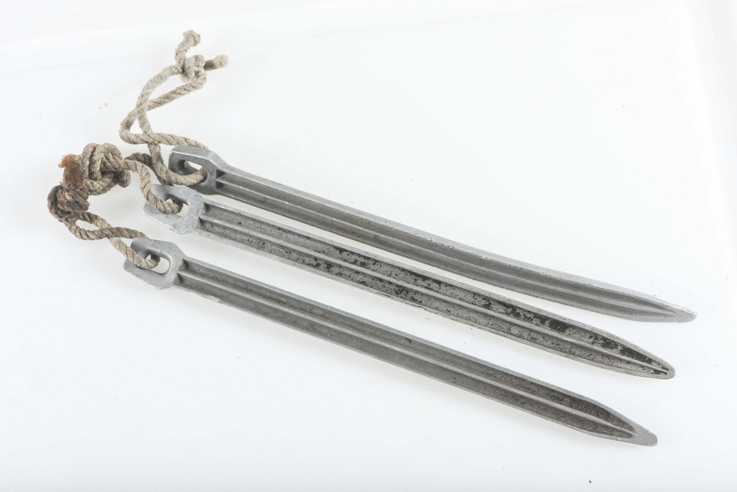 Three matching Zeltbahn pegs marked GA 38 — image 3