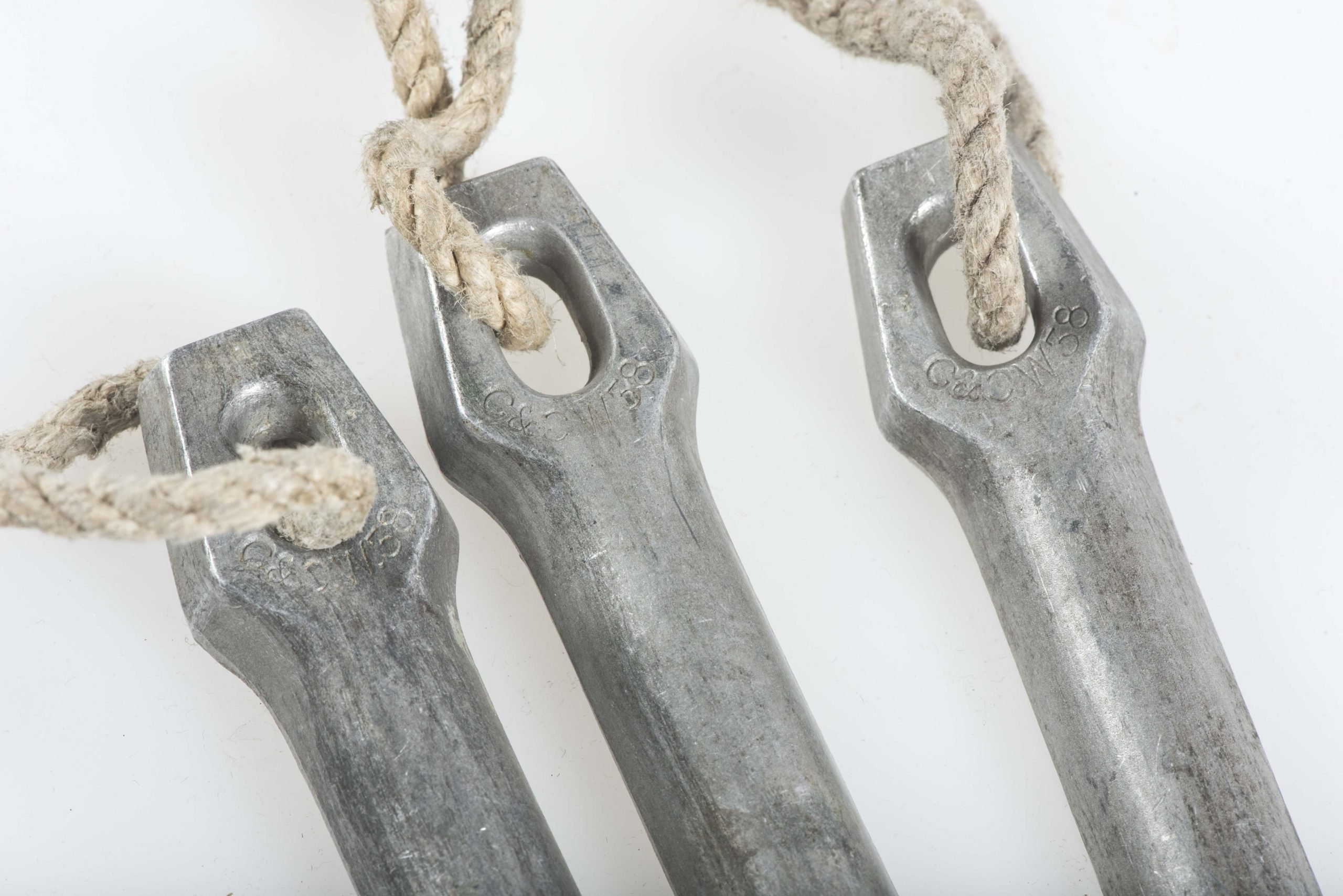 Three matching Zeltbahn pegs marked C&CW 38 — image 2