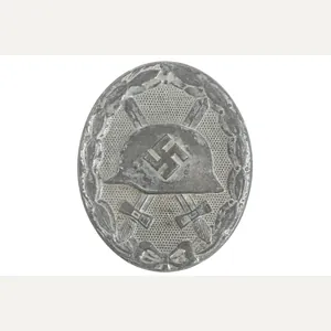 Silver wound badge marked 107