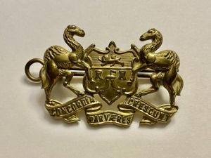 Merchant Taylors school O.T.C brass cap badge.